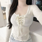 Lace-up top with long sleeves and round neck