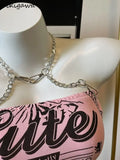 Sweet pink crop top with chain for a psycho-cute look