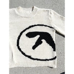 Y2K style sweater with Aphex Twin design