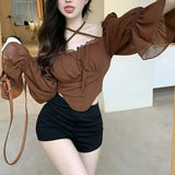 Fairy- grunge style blouse with puff sleeves and cross straps