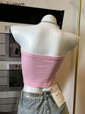 Sweet pink crop top with chain for a psycho-cute look