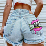 Y2K-inspirierte Denim-Shorts mit ausgefallenem Print und Fransen